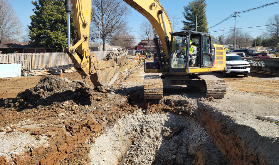 excavator installing a sewer system